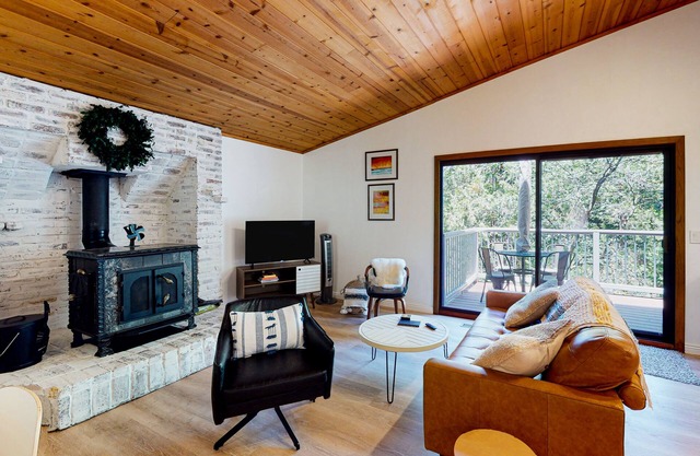 Updated home with central AC, W/D, wood stove, home office & high-speed WiFi