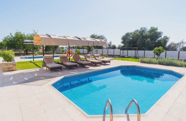 Villa with private pool and large balcony with sea view, ideal for families.