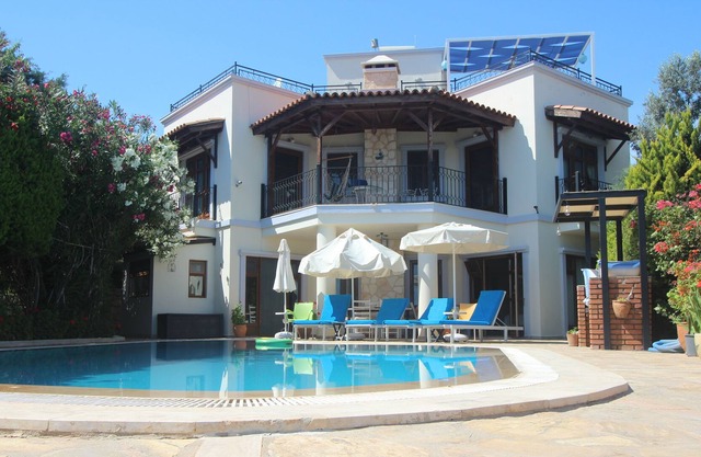 Villa with secluded private pool & garden and sea & mountain views.