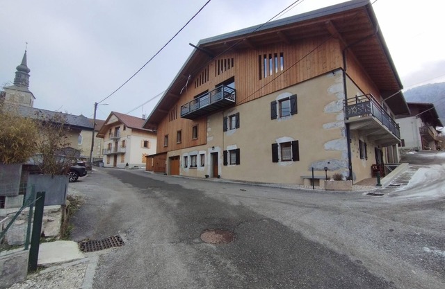 Villard in the heart of the green valley between lake and mountains