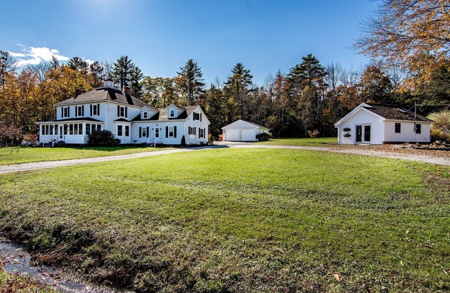 Walk to town of Blue Hill from this 4-bedroom/4 bath home on Parker Point Road!