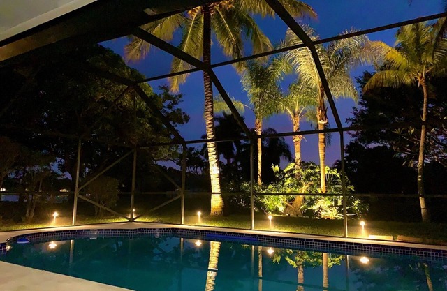 “Waterfront Elegance: Luxurious Equestrian Retreat with heated Pool”