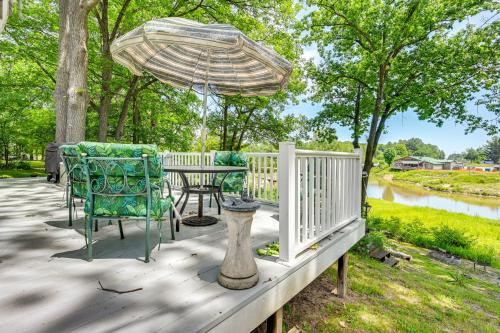 Waterfront Gladwin Home with Deck and Fire Pit!