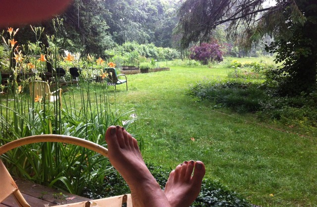 You're in a hot tub; you see gardens and hear wind blowing through the pines.