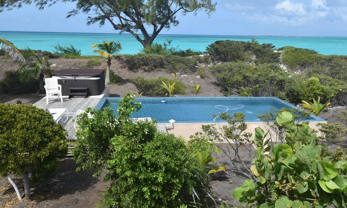 Great Exuma House | 4acres ON beach no drive 4 bedroom pool hot tub gym 3.5 baths 3+3outdoor showers
