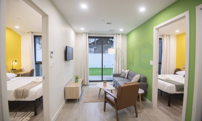 Queens Apartment | A Gem in the Heart of Queens: 2 Bed + 2 Bath with Large Backyard