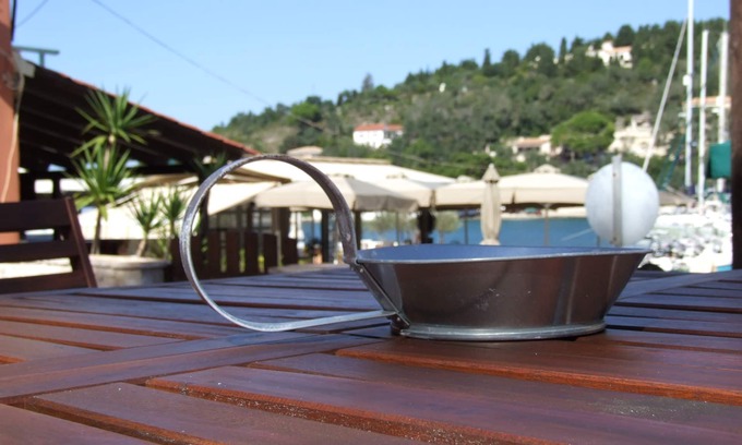 Lakka Villa | A Lovely beachfront stone house with a large yard and garden in Lakka Paxos.