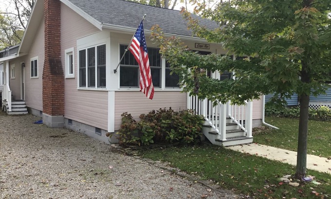 Lakeside Cottage | A picture perfect restored original cottage located inside the gates of Lakeside