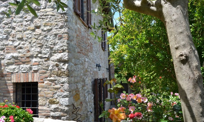 Corciano House | Ancient rock house with garden,situated in the centre,with view of Umbria