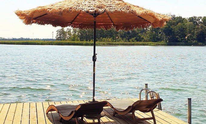 gmina Moryn Apartment | Annie - attic apartment with fireplace & balcony | on the lake with private jetty & 2500 sqm garden