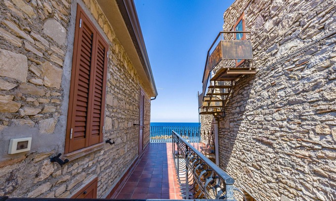 Patti Apartment | Apartment 'La Risacca Suite' with Sea View, Private Terrace and Air Conditioning