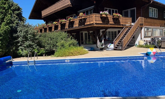 New Glarus House | Authentic Swiss Chalet w/private saltwater pool, sauna, grill, fire pit & more