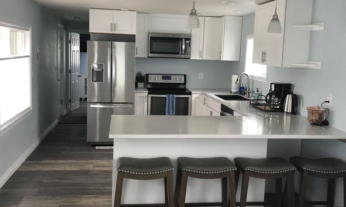 North Douglas House | Beachfront community with city and mountain view.