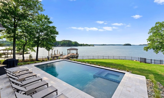 Denver House | Beautiful 5 Bedroom Lake-Front Home with Heated Saltwater Pool, Spa, and Dock