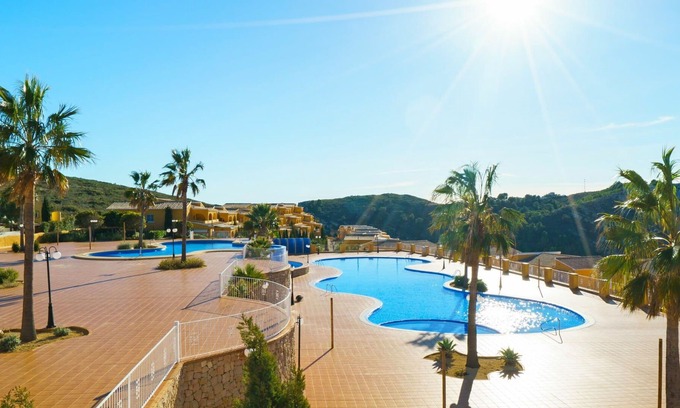 Cumbre del Sol Apartment | Beautiful apartment for 4 guests with pool, A/C, WIFI, TV, patio and parking