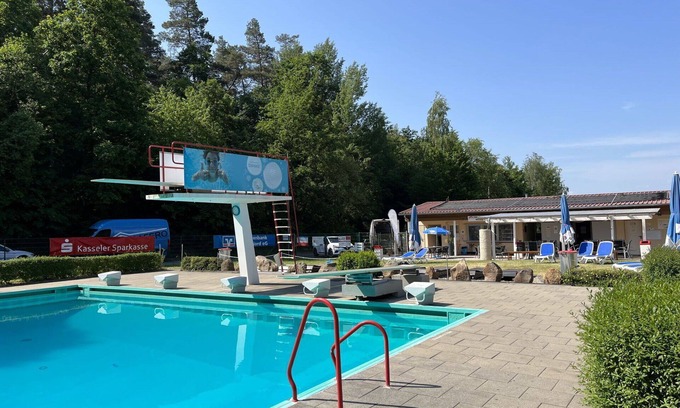 Bad Emstal House | Beautiful apartment in villa for 3 guests with pool, WIFI, TV, terrace, pets allowed and parking