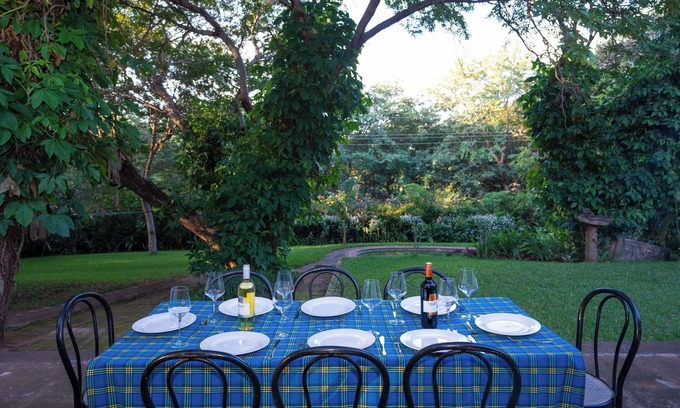 Victoria Falls House | Beautiful home, lush garden, and pool. Walking distance to town and waterfall.