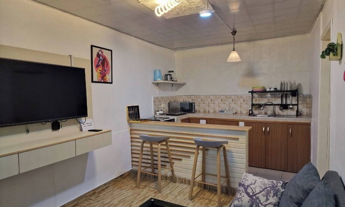 Dansoman House | Blueberry suite 1 with a minimalist touch to make you feel @ home.