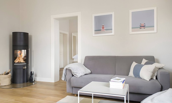 Fehmarn Apartment | Bright Stuuv – Comfortable Living with Sunny Terrace and Fireplace