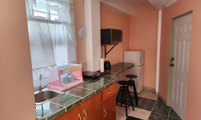 Roseau Apartment | C & M Suites Your Haven in the City