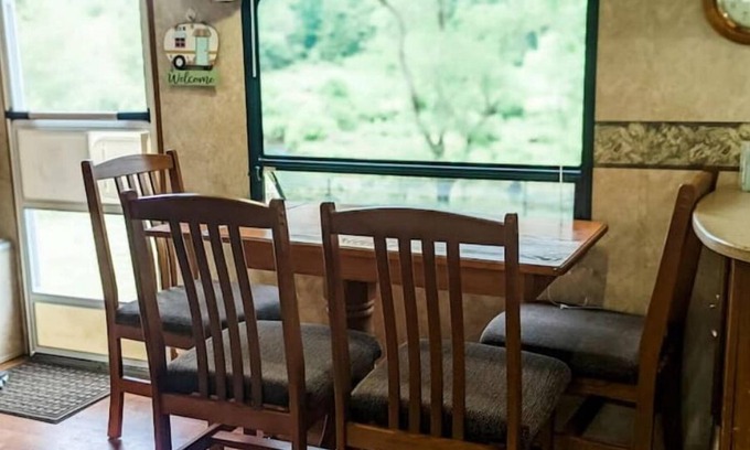 Burks Fork Cabin | Camper in middle of farm setting with creek view