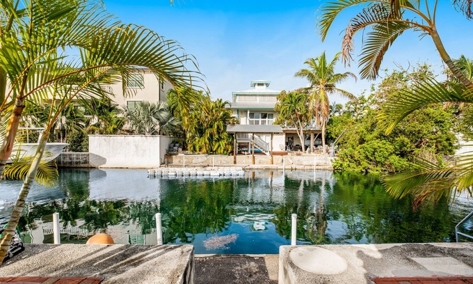Big Coppitt Key House | Canalside condo with private dock, boat ramp, water-view patio, central AC & W/D