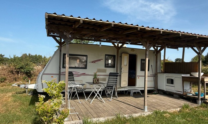 Champsac RV Rental | Caravan 'Vue Sur L'étang' with Lake View, Shared Pool and Private Terrace
