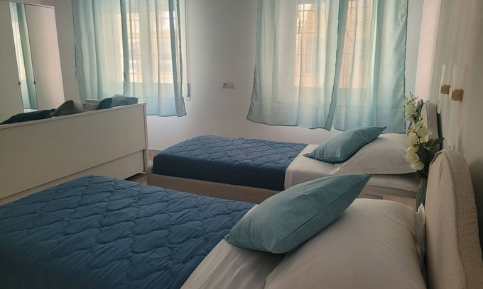 Quartiere XXXIV Lido di Ostia Levante Apartment | Charming 2-bedroom apartment with WiFi, AC in welcoming Lido di Ostia