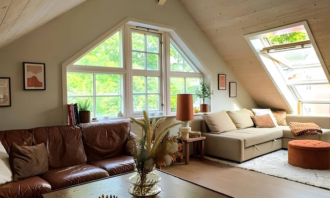 Royken Apartment | Charming attic apartment by the sea - with fireplace and cozy living room