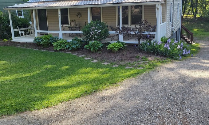 Bear Creek House | Charming bedroom and bath with private entrance and screened porch .