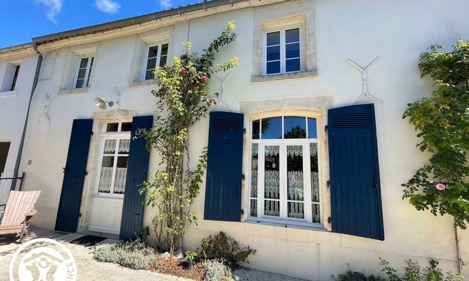 Damvix Cottage | Charming Riverside House with Canoes, Garden, and Nearby Market in Marais Poitevin