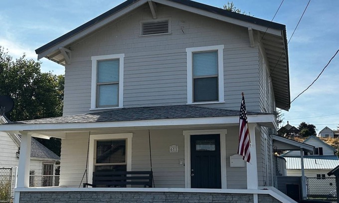 Pendleton House | Cheerful home with front porch swing.
