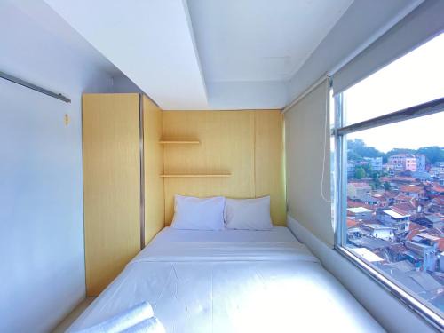 Cipaganti Apartment | Comfortable 2BR Apartment AC in Living Room at The Jarrdin Cihampelas By Travelio