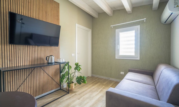 Tresauro Condo | Comfortable room with sofa bed and suitable for 4 people