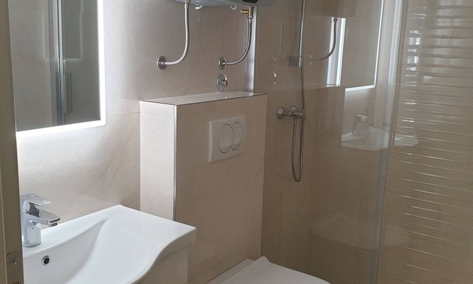 Skaljari Apartment | Comfortable studio apartment with patio, two minutes walk from the nearest beach