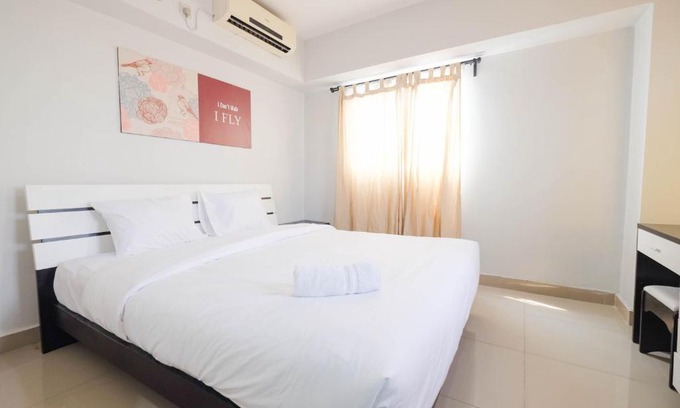 Karet Apartment | Contemporary 2BR at The Wave Apartment By Travelio
