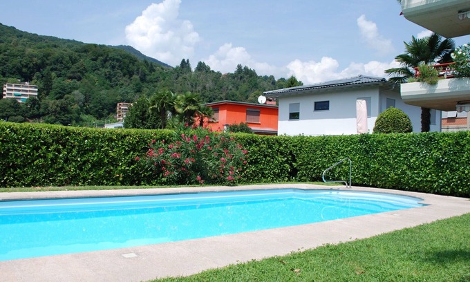 Caslano Apartment | Cosy apartment for 4 guests with WIFI, pool, TV, patio and pets allowed