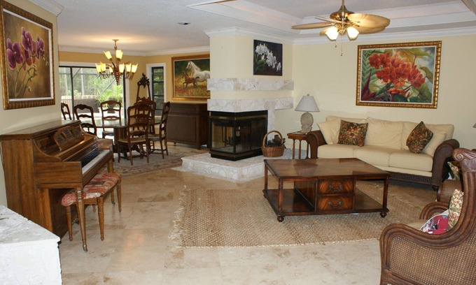 Hunt Club Bed & Breakfast | Country Garden Room with Water Garden feature and Queen Bed.