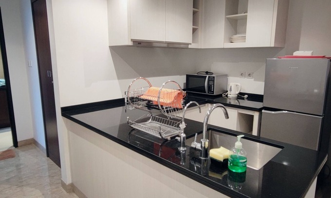 Bumi Serpong Damai Apartment | Cozy 2-bedroom apartment in enjoyable Banten with WiFi, fitness room