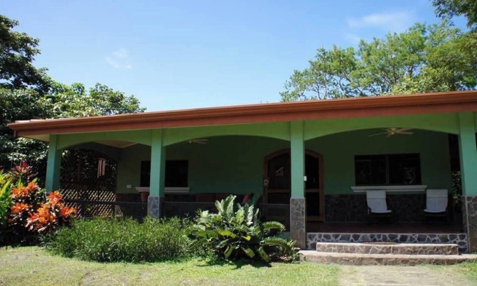 Junquillal House | Cozy 3-bedroom retreat in Tierra Pacifica with lush gardens, AC, hammock rancho, and full access to pool, gym, yoga room, and more.