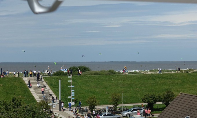 Norddeich Apartment | Cozy attic studio Norddeich panoramic window with sea view beach 50 meters