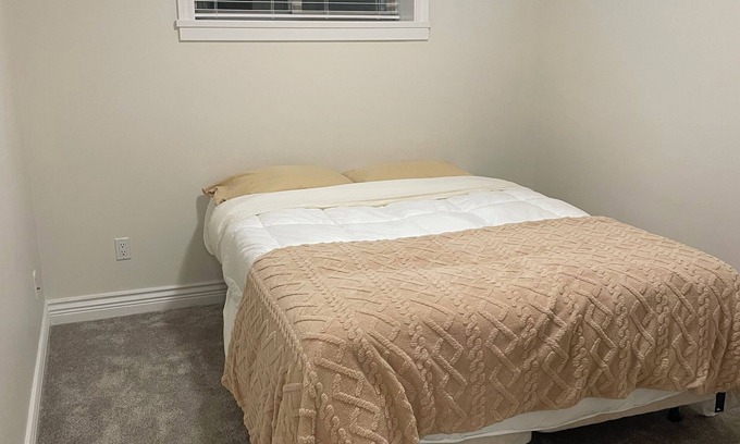 East Clayton House | Cozy, clean basement suite in beautiful Clayton Heights with gas fireplace!