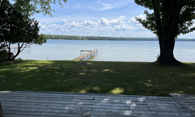 Interlochen Cottage | Delightful sunny beachfront cottage with fire pit 4 min to Concerts!