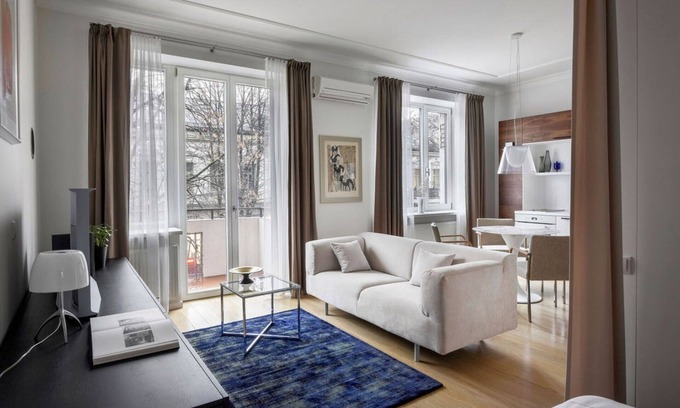 Liberty Avenue Apartment | Design Central Studio Apartment with Balcony by Hostlovers