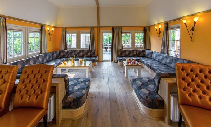 De Bult Villa | Designed home with bedstead, surrounded by forest
