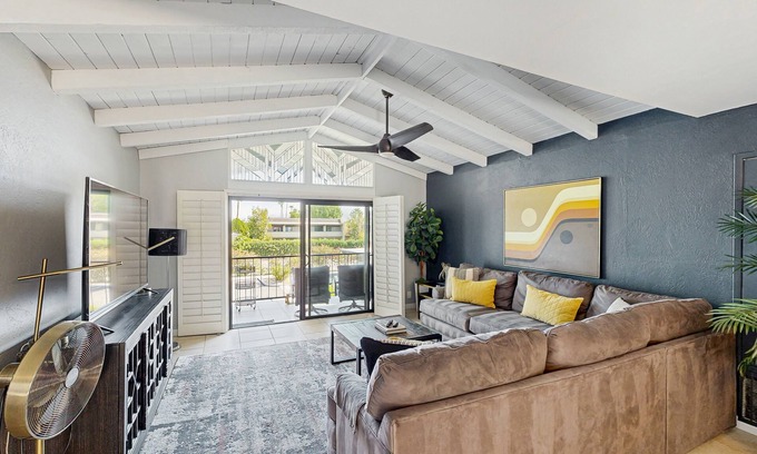 Baristo Condo | Dive into Palm Springs fun with a stylish home base featuring poolside lounging.