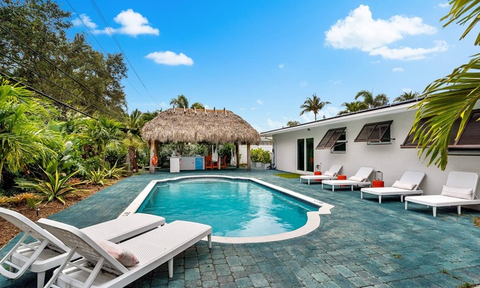 Garden Isles House | Eccentric home with pool, tiki hut & outdoor kitchen