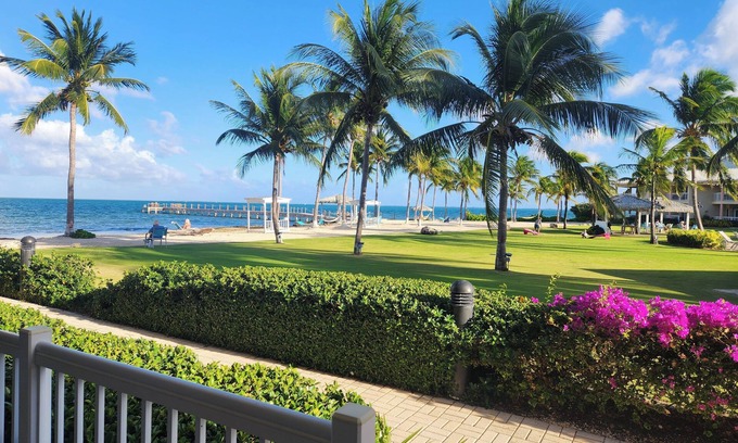 Crystal Harbour Apartment | Elegant 1BR Oceanview Suite w/Full Kitchen, Bar & Relaxing Pool Area