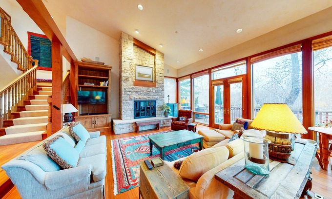 West End House | Elegant Aspen townhouse with an inviting deck, fireplace, and washer/dryer
