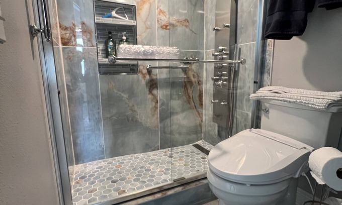Sunnyside House | Enjoy inside and out! One step to sand and back to a shower tower or a Jacuzzi